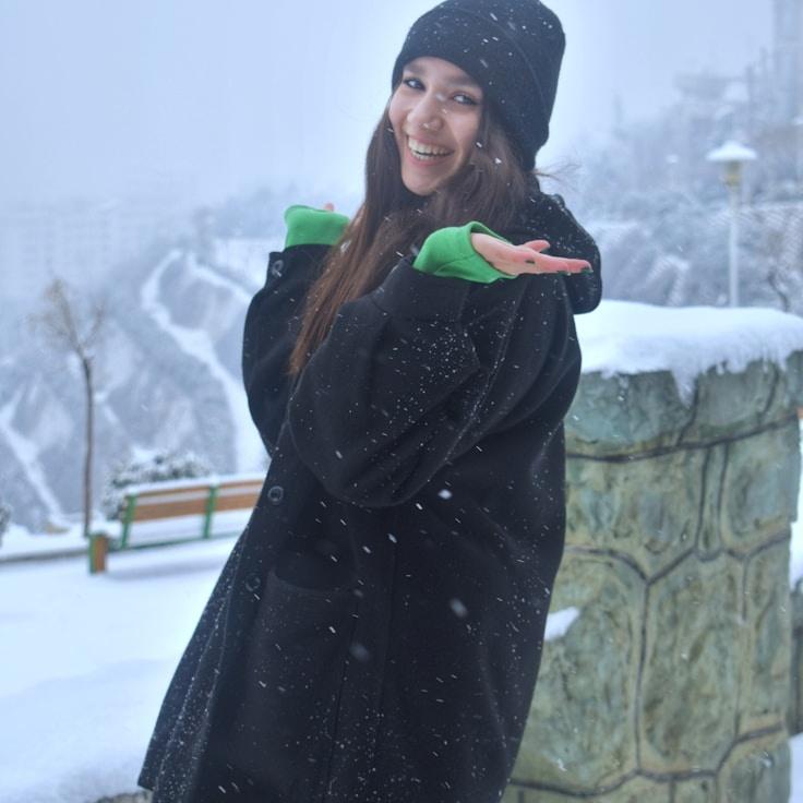 Kaveri Mehta, Lead Design Curator at PlainNodeAxis, reviewing corporate floral arrangements